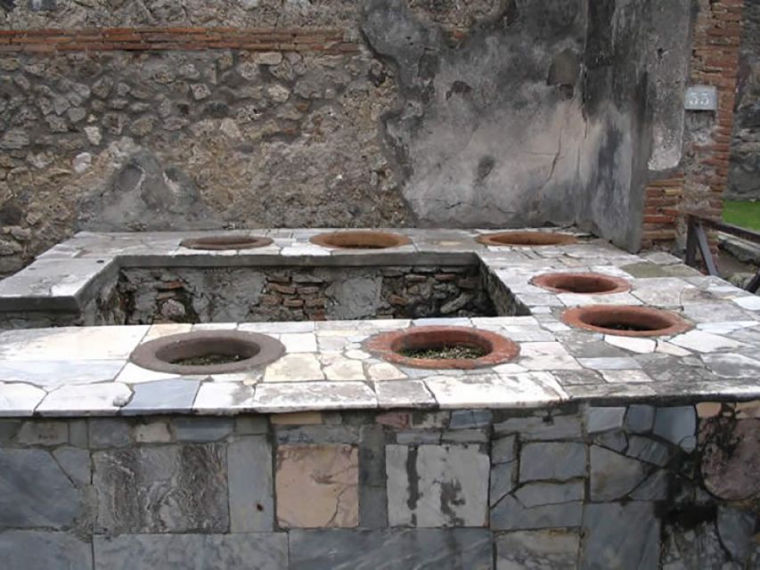 From Rome: Pompeii Day Trip by Fast Train and Car - Amphitheater: crowds, craft, and sudden silence